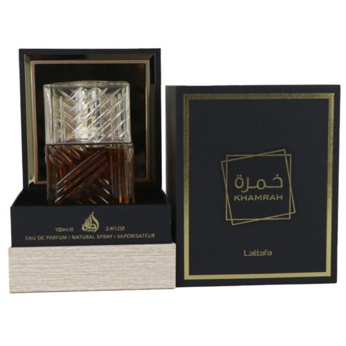 Khamrah Eau de Parfum 100ml by Lattafa, featuring an intricate glass bottle with amber liquid and clear geometric stopper, displayed next to its black and gold packaging.