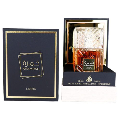 Khamrah Eau de Parfum by Lattafa, featuring a luxurious amber-colored bottle with intricate crystal-like details, placed inside a black and gold box.