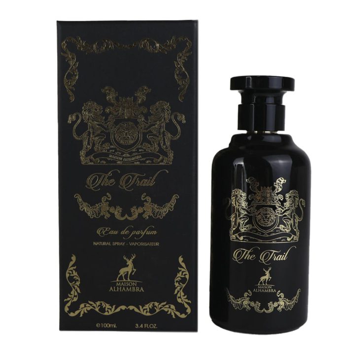 The "The Trail" perfume bottle displayed next to its matching black and gold box, forming a cohesive luxury set.