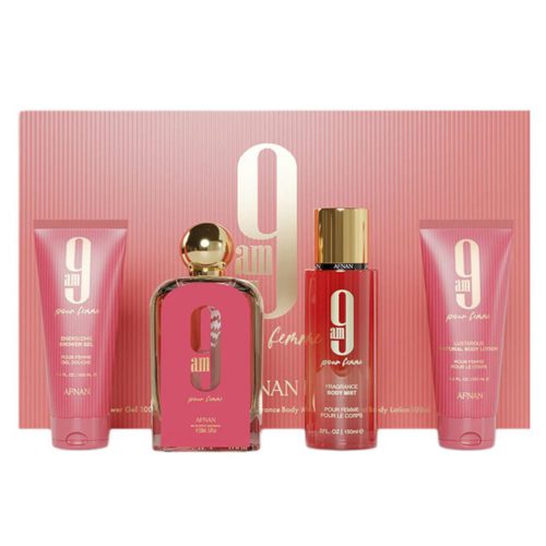 Afnan 9AM Pour Femme gift set, featuring a pink and gold-themed collection including a perfume bottle, body mist, shower gel, and body lotion, elegantly arranged in front of its matching pink packaging.